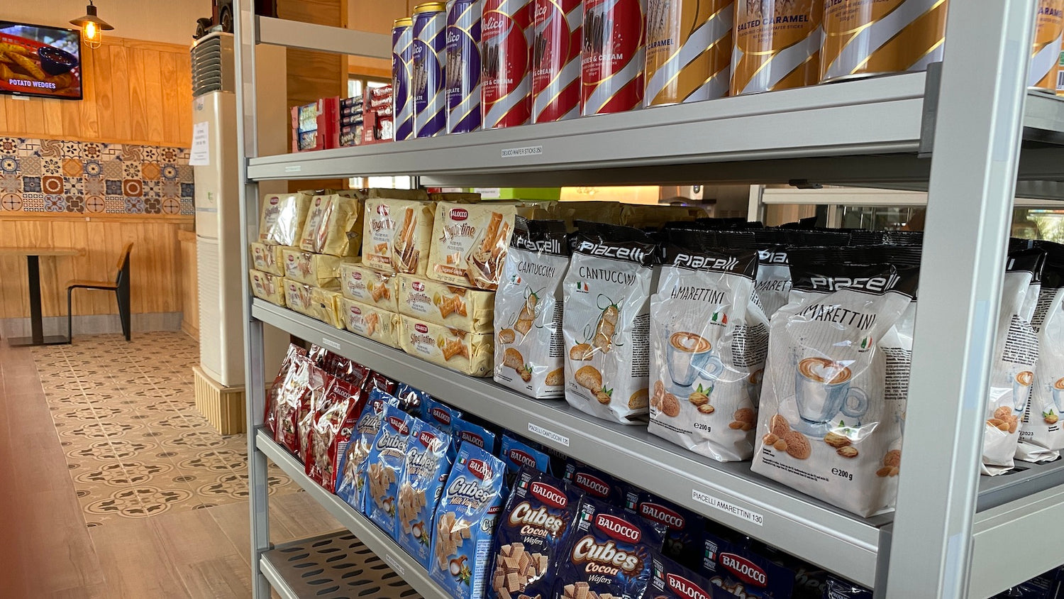 Café Tukan grocery items on a rack